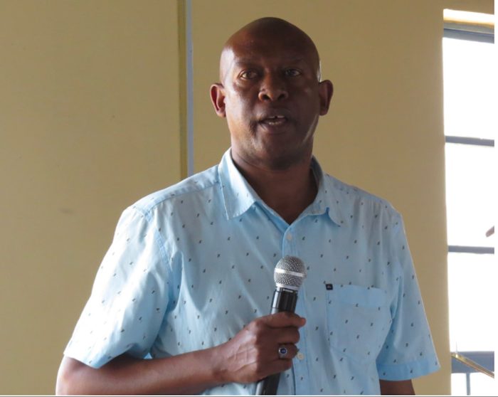 Colleague speaking in tribute to the late Jeremiah Wandu Kimemia