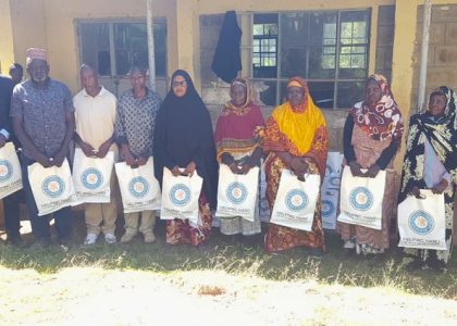 Beneficiaries with Qurbani 2026 meat packs from IFK and HHRD