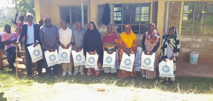 Beneficiaries with Qurbani 2026 meat packs from IFK and HHRD